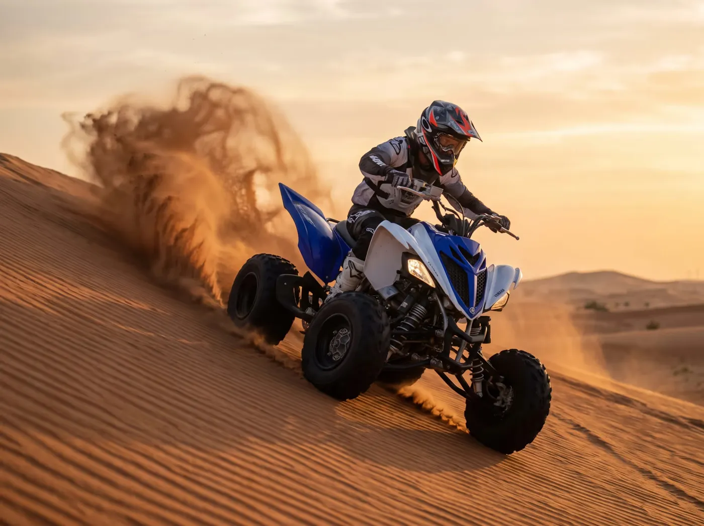 Yamaha Raptor 700 manual sport quad on the Dubai dunes، صورة 4